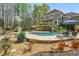 Outdoor pool and large backyard with deck in a wooded area at 1165 Lea Dr, Roswell, GA 30076