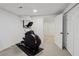 Basement with exercise bike in the room with carpet floors and white walls at 1165 Lea Dr, Roswell, GA 30076