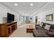 Finished basement featuring a pool table, sofa, and large television for entertaining at 1165 Lea Dr, Roswell, GA 30076
