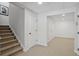 Finished basement featuring stairs and white doors at 1165 Lea Dr, Roswell, GA 30076