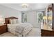 Bedroom featuring a large bed, neutral color palette, and two windows at 1165 Lea Dr, Roswell, GA 30076