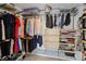 Walk-in closet featuring plenty of hanging storage and shelving at 1165 Lea Dr, Roswell, GA 30076