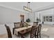 Formal dining room with wood table set and view of living area built-ins at 1165 Lea Dr, Roswell, GA 30076