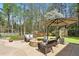 Backyard patio with a fire pit and comfortable seating at 1165 Lea Dr, Roswell, GA 30076