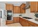 Gourmet kitchen features custom cabinets, stainless steel appliances, and modern gas range at 1165 Lea Dr, Roswell, GA 30076