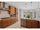 Modern kitchen featuring custom cabinets, stainless steel appliances, and convenient kitchen island at 1165 Lea Dr, Roswell, GA 30076