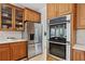 Well-equipped kitchen showcases stainless steel refrigerator and modern double ovens at 1165 Lea Dr, Roswell, GA 30076