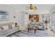 Open concept living area with view into modern kitchen and backyard access at 1165 Lea Dr, Roswell, GA 30076