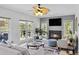 Bright living room with cozy fireplace, modern furnishings, and large windows at 1165 Lea Dr, Roswell, GA 30076