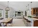 Open-concept living space with dining area and counter seating on the island at 1165 Lea Dr, Roswell, GA 30076