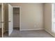 Bedroom featuring neutral carpet and a closet with an open door at 181 Bernice Dr, Lawrenceville, GA 30045