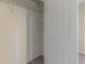 View into walk-in closet with white wire shelving at 181 Bernice Dr, Lawrenceville, GA 30045