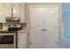 Well-lit kitchen featuring stainless steel appliances and ample storage with white cabinets at 181 Bernice Dr, Lawrenceville, GA 30045