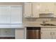 Spacious kitchen featuring a stainless steel dishwasher, double sink, and abundant counter space at 181 Bernice Dr, Lawrenceville, GA 30045