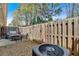 Cozy fenced backyard with a patio set and well-maintained air conditioning unit at 1929 Lake Heights Nw Cir # 2, Kennesaw, GA 30152