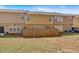 Townhome backyard featuring a patio, grill, and freshly cut grass at 1929 Lake Heights Nw Cir # 2, Kennesaw, GA 30152