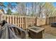Cozy backyard with patio furniture, outdoor seating, and a wooden privacy fence at 1929 Lake Heights Nw Cir # 2, Kennesaw, GA 30152