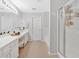 Bright, spacious bathroom with dual vanities, a walk-in shower, and a soaking tub at 1929 Lake Heights Nw Cir # 2, Kennesaw, GA 30152