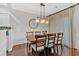 Dining room featuring a wooden table, stylish chairs, and elegant lighting fixture at 1929 Lake Heights Nw Cir # 2, Kennesaw, GA 30152