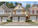 Charming townhome featuring a stone facade, two-car garage, and inviting curb appeal at 1929 Lake Heights Nw Cir # 2, Kennesaw, GA 30152