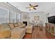Cozy living room featuring hardwood floors, a comfortable sofa, and a fireplace at 1929 Lake Heights Nw Cir # 2, Kennesaw, GA 30152