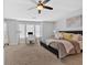 Spacious main bedroom with plush carpet, neutral walls, and a comfortable seating area at 1929 Lake Heights Nw Cir # 2, Kennesaw, GA 30152
