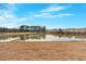 Scenic pond reflects the beautiful sky and surrounding trees and townhomes at 1929 Lake Heights Nw Cir # 2, Kennesaw, GA 30152