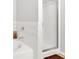 Bright white shower with glass enclosure and neutral tile at 1929 Lake Heights Nw Cir # 2, Kennesaw, GA 30152