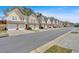 Street view featuring a row of charming townhomes with attached garages and well-maintained landscaping at 1929 Lake Heights Nw Cir # 2, Kennesaw, GA 30152