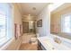 Well-lit bathroom with a shower-tub combo, white vanity, and neutral color scheme at 6626 Sterling Dr, Sandy Springs, GA 30328