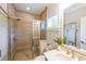 Bathroom featuring a glass enclosed tile shower and white vanity at 6626 Sterling Dr, Sandy Springs, GA 30328