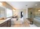 Bright bathroom with double vanity, soaking tub, and large glass enclosed shower at 6626 Sterling Dr, Sandy Springs, GA 30328
