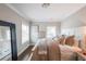Bedroom with hardwood floors and light colored walls, decor and throw pillows at 6626 Sterling Dr, Sandy Springs, GA 30328
