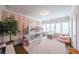 Bright bedroom features a pink rug, bunk bed and lots of natural light at 6626 Sterling Dr, Sandy Springs, GA 30328
