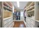Organized walk-in closet with built-in shelving and drawers, maximizing storage space in the home at 6626 Sterling Dr, Sandy Springs, GA 30328