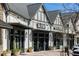 Street view of commercial building with storefronts, awnings, and outdoor seating at 6626 Sterling Dr, Sandy Springs, GA 30328