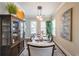 Elegant dining room featuring a wooden table, pendant lighting, decorative cabinet, and neutral wall colors at 6626 Sterling Dr, Sandy Springs, GA 30328