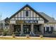 Commercial building with a Tudor-style facade and FOOD TERMINAL signage at 6626 Sterling Dr, Sandy Springs, GA 30328