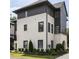 Charming exterior of a modern two-story home featuring white brick and black wood accents at 6626 Sterling Dr, Sandy Springs, GA 30328