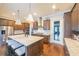 Modern kitchen featuring an island with barstool seating, stainless steel appliances, and custom cabinetry at 6626 Sterling Dr, Sandy Springs, GA 30328