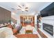 Spacious living room with hardwood floors, a fireplace, and an open view to the kitchen at 6626 Sterling Dr, Sandy Springs, GA 30328