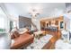 Open-concept living room with hardwood floors and direct access to the kitchen and dining area at 6626 Sterling Dr, Sandy Springs, GA 30328