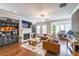 Comfortable living room with hardwood floors, a fireplace, and a leather sofa at 6626 Sterling Dr, Sandy Springs, GA 30328