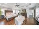 Tranquil main bedroom suite with hardwood floors, a tray ceiling, and ample natural light at 6626 Sterling Dr, Sandy Springs, GA 30328
