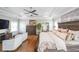 Inviting main bedroom featuring hardwood floors, a ceiling fan, and lots of natural light at 6626 Sterling Dr, Sandy Springs, GA 30328