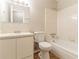 Full bathroom with a tub and shower combination, sink, and neutral tile at 1803 Gingham Ct, Lithonia, GA 30058