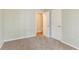 Carpeted bedroom with ample closet space and neutral paint at 1803 Gingham Ct, Lithonia, GA 30058