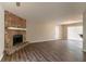 Spacious living room featuring a stone fireplace and sliding glass doors to the backyard at 1803 Gingham Ct, Lithonia, GA 30058