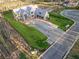 New home under construction with a manicured lawn and a long driveway, aerial view at 225 Maison Court, Roswell, GA 30076