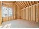 Bedroom #2 under construction displaying two windows and an exposed ceiling at 225 Maison Court, Roswell, GA 30076